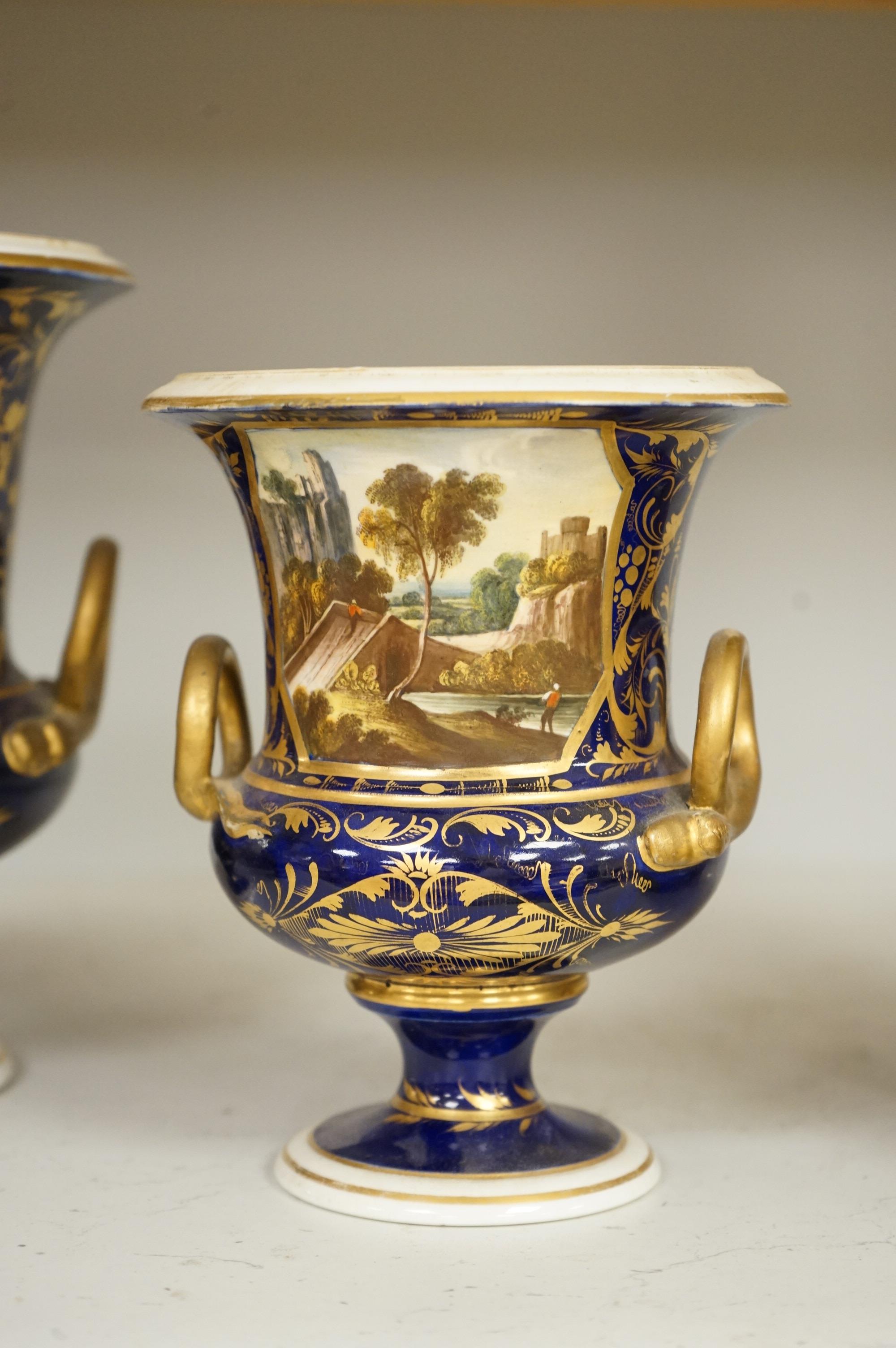 A set of three Derby campana vases, painted with named views, circa 1820, tallest 20.5cm